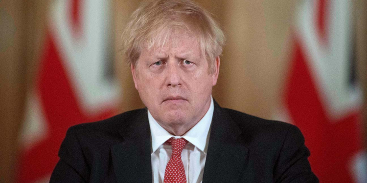 Britain's Prime Minister Boris Johnson addresses a news conference to give a daily update on the government's response to the novel coronavirus COVID-19 outbreak, inside 10 Downing Street in London on March 20, 2020. - Britain's government Friday rolled out a series of extra measures including direct grants to cover wages of employees who have been temporarily furloughed, as it ordered cafes, pubs and restaurants to close entirely. (Photo by JULIAN SIMMONDS / POOL / AFP) (Photo by JULIAN SIMMONDS/POOL/AFP via Getty Images)