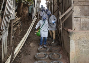 Health workers from Doctors Without Borders visit a squatters camp to conduct medical examinations and avoid the spread of the COVID-19 in Sao Bernardo do Campo, greater Sao Paulo area, Brazil, Wednesday, June 3, 2020. (AP Photo/Andre Penner)