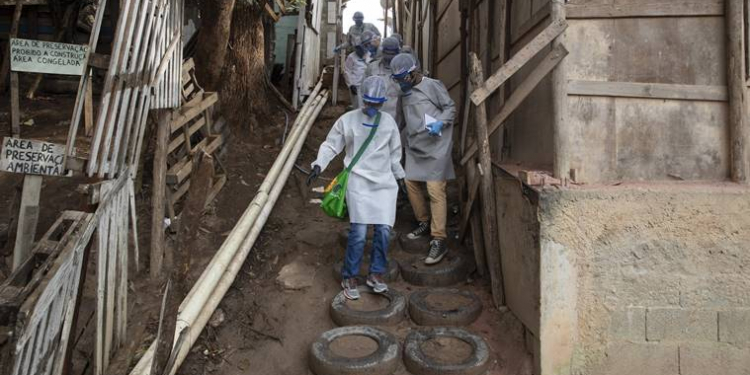 Health workers from Doctors Without Borders visit a squatters camp to conduct medical examinations and avoid the spread of the COVID-19 in Sao Bernardo do Campo, greater Sao Paulo area, Brazil, Wednesday, June 3, 2020. (AP Photo/Andre Penner)