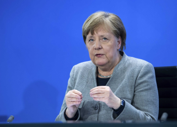 Germany's Chancellor Angela Merkel speaks at a press conference in the Federal Chancellery, Berlin, Wednesday April 15, 2020. After much-anticipated talks Wednesday with Germany’s 16 state governors, Chancellor Angela Merkel set out a plan for the first steps of a cautious restart of public life — following countries including neighboring Austria and Denmark in launching a slow loosening of restrictions. (Bernd von Jutrczenka/Pool via AP)