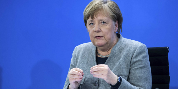 Germany's Chancellor Angela Merkel speaks at a press conference in the Federal Chancellery, Berlin, Wednesday April 15, 2020. After much-anticipated talks Wednesday with Germany’s 16 state governors, Chancellor Angela Merkel set out a plan for the first steps of a cautious restart of public life — following countries including neighboring Austria and Denmark in launching a slow loosening of restrictions. (Bernd von Jutrczenka/Pool via AP)