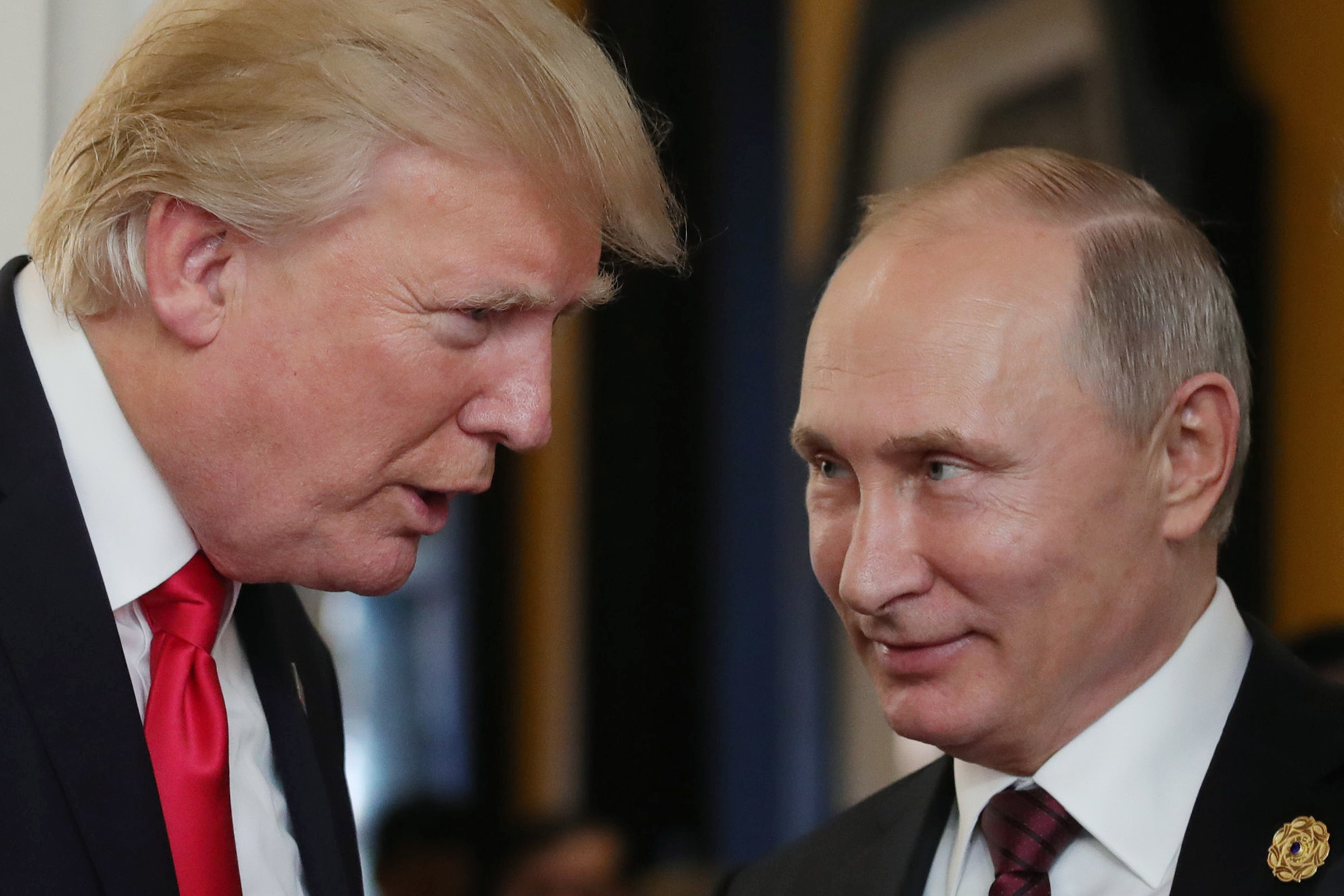 US President Donald Trump (L) chats with Russia's President Vladimir Putin as they attend the APEC Economic Leaders' Meeting, part of the Asia-Pacific Economic Cooperation (APEC) leaders' summit in the central Vietnamese city of Danang on November 11, 2017. / AFP PHOTO / SPUTNIK / Mikhail KLIMENTYEV        (Photo credit should read MIKHAIL KLIMENTYEV/AFP/Getty Images)