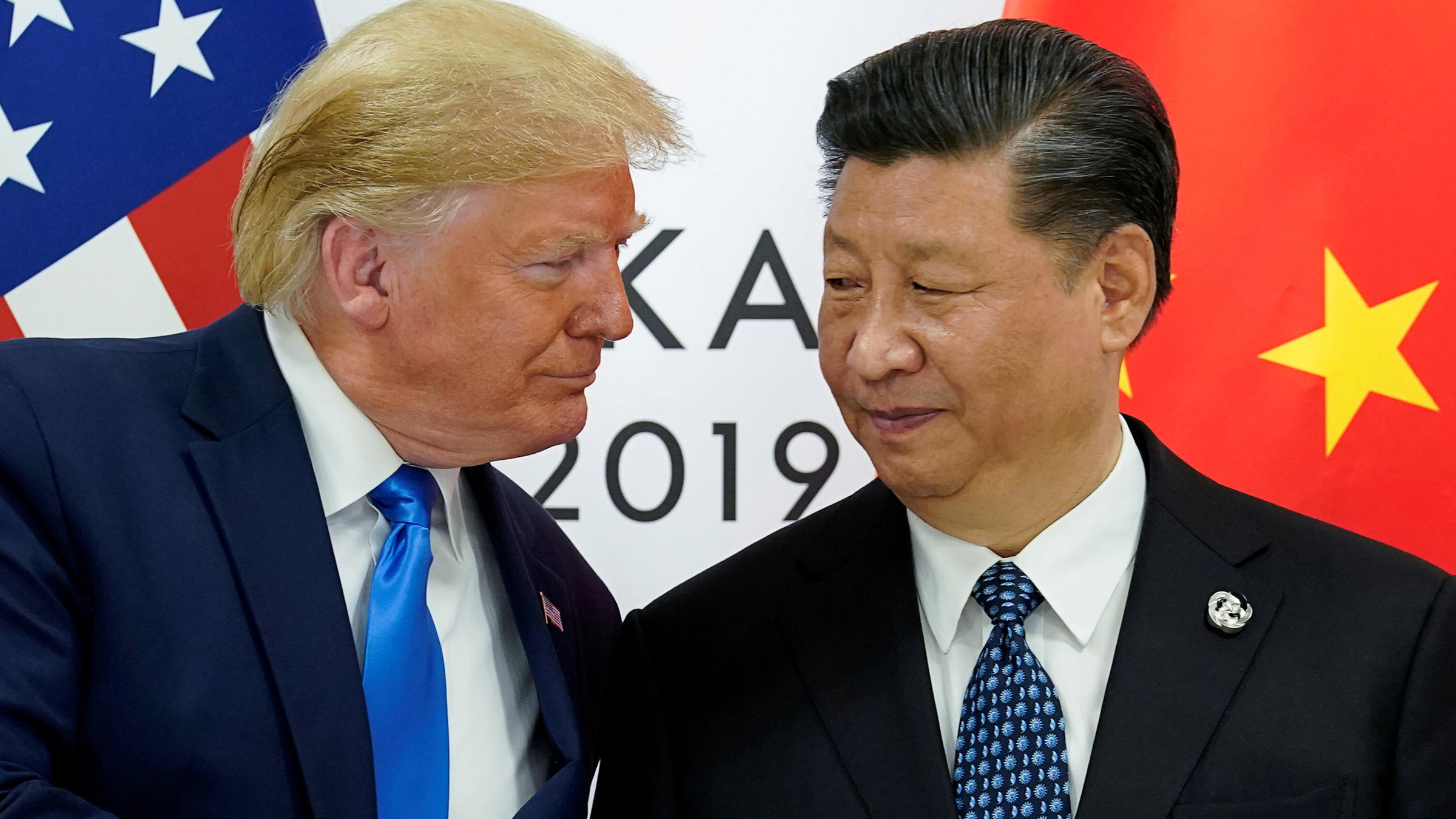 “China supports the idea of a comprehensive review of the global response to COVID-19, after it is brought under control,” says President Xi Jinping, seen here with President Trump last summer.
