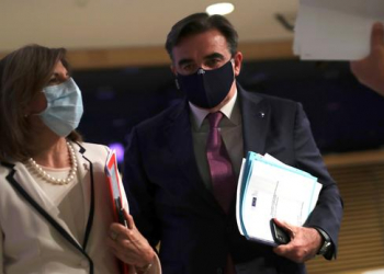 European Commission Vice-President Margaritis Schinas and European Health Commissioner Stella Kyriakides leave the podium after addressing a media conference on preparedness for possible future outbreaks of the coronavirus disease (COVID-19), at EU headquarters in Brussels, Belgium July 15, 2020. Francisco Seco/Pool via REUTERS
