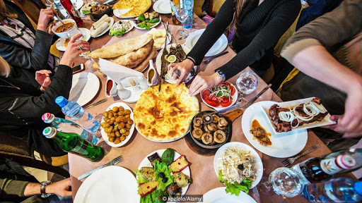 ET8A3T Georgian traditional food like Imeretian khachapuri, roasted mushrooms, Pkhali salad, roasted fshes and potatoes and lamb kebab