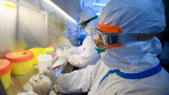 Workers in protective suits conduct RNA tests on specimens inside a laboratory at a centre for disease control and prevention, as the country is hit by an outbreak of the novel coronavirus, in Taiyuan, Shanxi province, China February 14, 2020. Picture taken February 14, 2020. cnsphoto via REUTERS   ATTENTION EDITORS - THIS IMAGE WAS PROVIDED BY A THIRD PARTY. CHINA OUT.