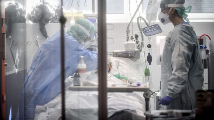 Medical personnel at work in the intensive care unit of the hospital of Brescia, Italy, Thursday, March 19, 2020. Italy has become the country with the most coronavirus-related deaths, surpassing China by registering 3,405 dead. Italy reached the gruesome milestone on the same day the epicenter of the pandemic, Wuhan, China, recorded no new infections. For most people, the new coronavirus causes only mild or moderate symptoms. For some it can cause more severe illness. (Claudio Furlan/LaPresse via AP)