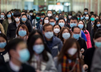 Commuters wearing protective masks walk through Hong Kong Station, operated by MTR Corp., in Hong Kong, China, on Wednesday, Jan. 29, 2020. Governments tightened international travel and border crossings with China as they ramped up efforts to stop the spread of the disease. Photographer: Paul Yeung/Bloomberg via Getty Images