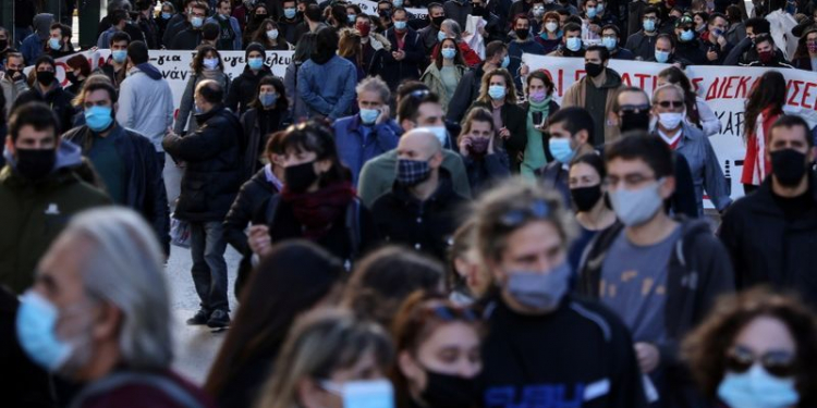 Demonstrators wearing protective masks take part in a protest during a 24-hour general strike of Greek public sector workers, demanding hiring of doctors and other medical staff to fight against the coronavirus disease (COVID-19) pandemic, in Athens, Greece, November 26, 2020. REUTERS/Alkis Konstantinidis