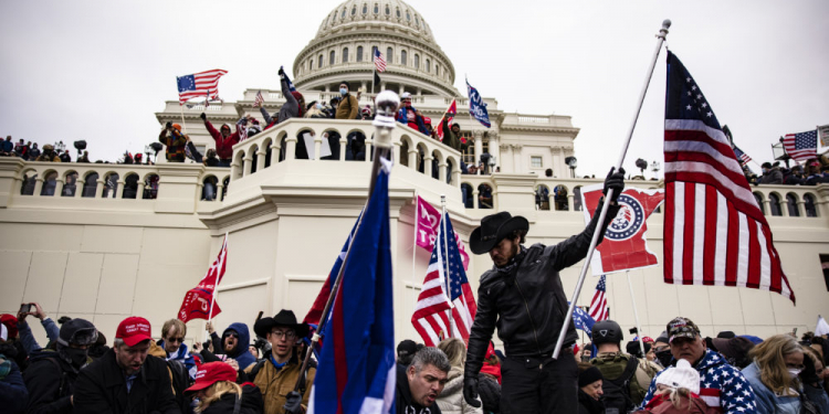 WASHINGTON, DC - JANUARY 06: Pro-Trump supporters storm the U.S. Capitol following a rally with President Donald Trump on January 6, 2021 in Washington, DC. Trump supporters gathered in the nation's capital today to protest the ratification of President-elect Joe Biden's Electoral College victory over President Trump in the 2020 election. (Photo by Samuel Corum/Getty Images)
