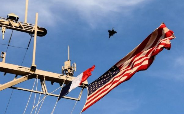161025-N-FP878-227
MEDITERRANEAN SEA (Oct. 25, 2016) A French Rafale figher jet conducts a fly over of USS Ross (DDG 71) as the French aircraft carrier FS Charles de Gaulle (R 91) conducts flight operations Oct. 25, 2016.  Ross, an Arleigh Burke-class guided-missile destroyer, forward-deployed to Rota, Spain, is providing multi-warfare defense support to Charles de Gaulle carrier-based operations in the Eastern Mediterranean against identified ISIL positions in support of Operation Inherent Resolve.  (U.S. Navy photo by Petty Officer 1st Class Theron J. Godbold/Released)