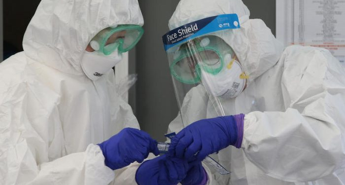 epa08270909 South Korean medical workers check their medical appliances prior to a disinfection against coronavirus outside the Seoul Human Resources Development Center in Seoul, South Korea, 05 March 2020. With over 5,500 confirmed cases of COVID-19, South Korea currently accounts for the highest number of infections outside mainland China.  EPA-EFE/KIM CHUL-SOO